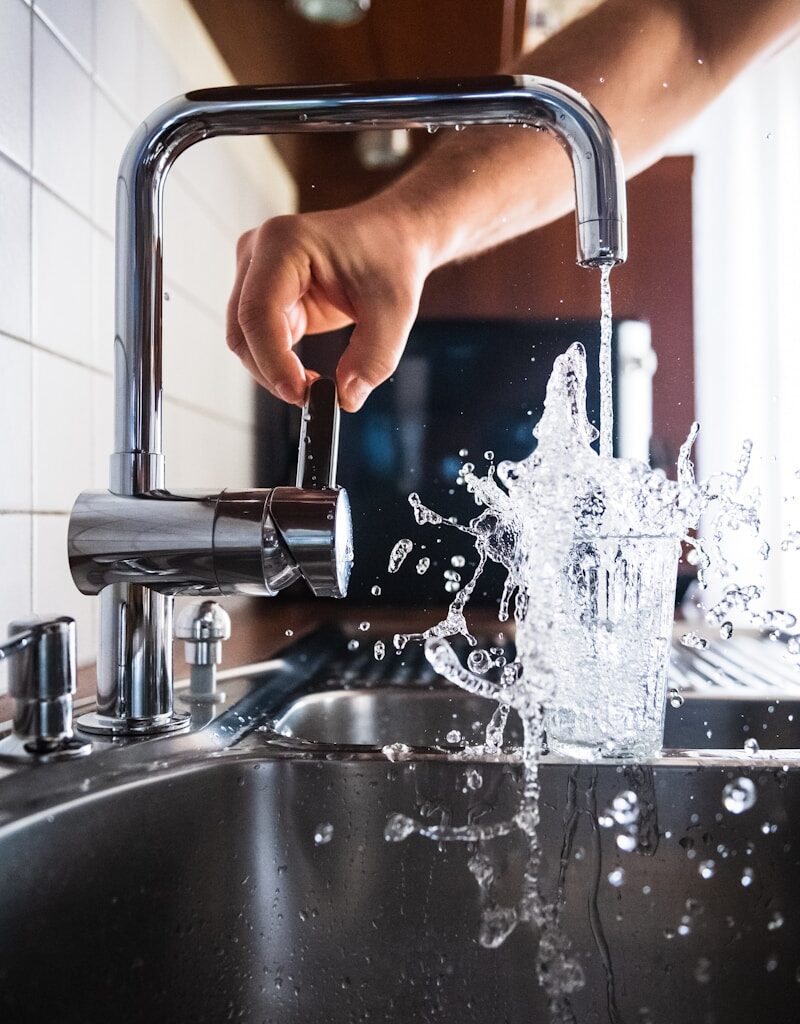 person opening faucet